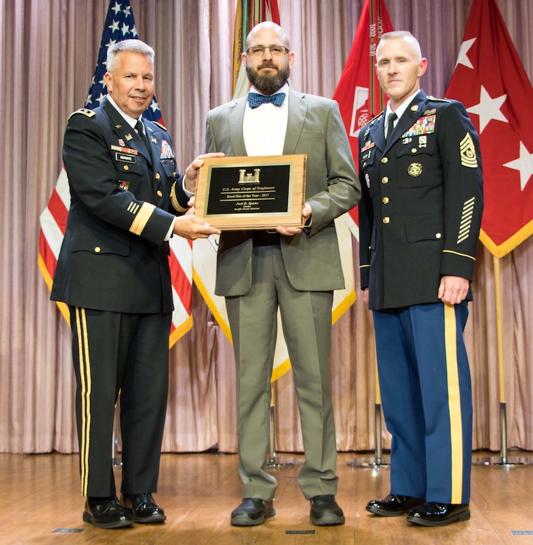Lt. Gen. Todd T. Semonite, the 54th Chief of Engineers and Commanding General of the U.S. Army Corps of Engineers (USACE), and Command Sergeant Major Bradley Houston, the 13th Command Sgt. Maj. of USACE, stand on stage with awardees at the National Awards Ceremony in Washington, D.C., Aug. 2, 2017. The National Awards Ceremony is an annual event that recognizes employees for their achievements. (U.S. Army Photo by Leanne Bledsoe