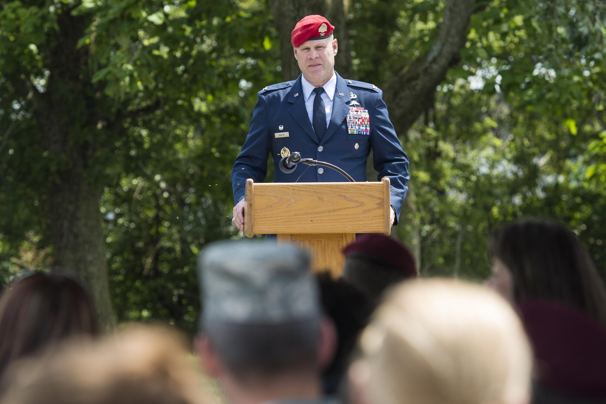 Col. Michael Martin speaks during a ceremony dedicating a six-mile stretch of Highway 121 in honor of Master Sgt. William L. McDaniel II's namesake in Greenville, Ohio, Aug. 14, 2017. McDaniel was a a Special Tactics pararescueman who was killed when the MH-47 Chinook helicopter he was in crashed in the Philippines Feb. 22, 2002. A pararescueman’s unique technical rescue skill sets are utilized during humanitarian and combat operations; they deploy anywhere, anytime, employ air-land-sea tactics into restricted environments to authenticate, extract, treat, stabilize and evacuate injured or isolated personnel. (U.S. Air Force photo by Wesley Farnsworth)