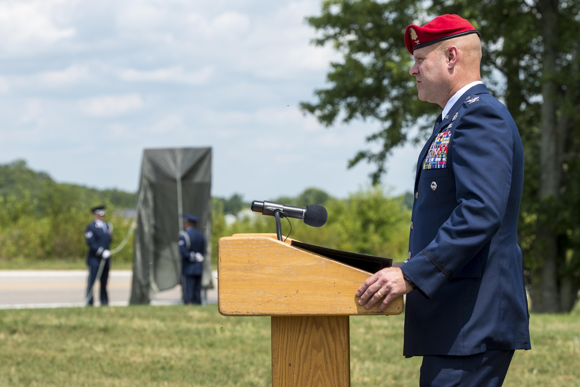 Col. Michael Martin speaks during a ceremony dedicating a six-mile stretch of Highway 121 in honor of Master Sgt. William L. McDaniel II's namesake in Greenville, Ohio, Aug. 14, 2017. McDaniel was a a Special Tactics pararescueman who was killed when the MH-47 Chinook helicopter he was in crashed in the Philippines Feb. 22, 2002. A pararescueman’s unique technical rescue skill sets are utilized during humanitarian and combat operations; they deploy anywhere, anytime, employ air-land-sea tactics into restricted environments to authenticate, extract, treat, stabilize and evacuate injured or isolated personnel. (U.S. Air Force photo by Wesley Farnsworth)