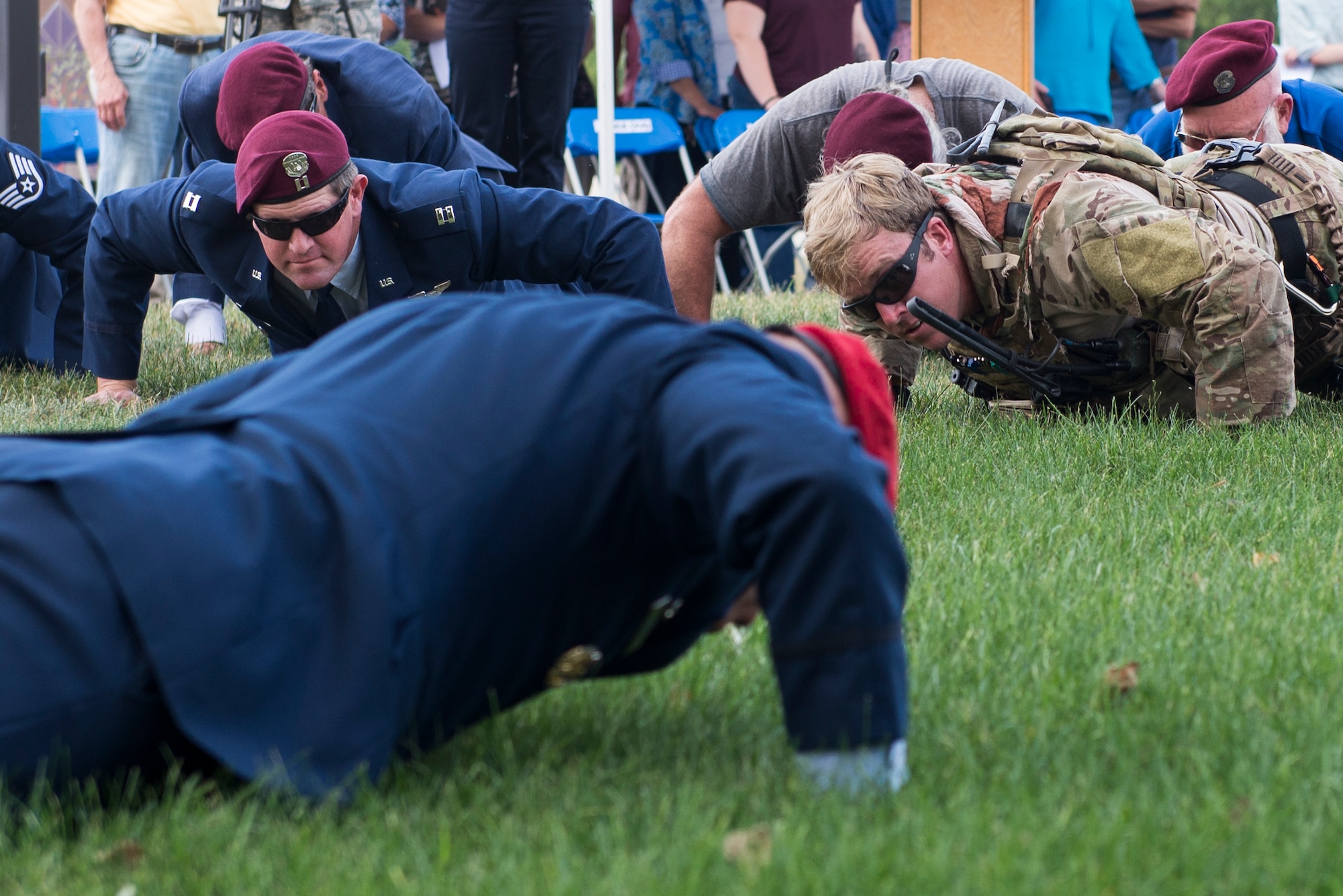 Col. Michael Martin, commander of the 24th Special Operations Wing, leads memorial push-ups following a ceremony dedicating a six-mile stretch of Highway 121 in honor Master Sgt. William L. McDaniel II's namesake, in Greenville, Ohio, Aug. 14, 2017. McDaniel was part of a joint, special operations team who were infiltrating an island in Southern Philippines when the MH-47 Chinook helicopter he was in crashed into the Sulu Sea Feb. 22, 2002. (U.S. Air Force photo by Wesley Farnsworth)