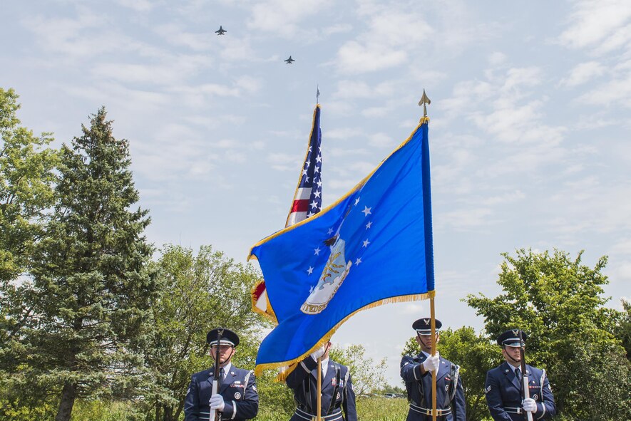 Two F-16 Fighting Falcons assigned to Ohio Air National Guard's 180th Fighter Wing fly over a ceremony dedicating an Ohio highway to a special operations hero in Greenville, Ohio, Aug. 14, 2017. Six miles of County Highway 121 was dedicated in Master Sgt. William L. McDaniel II’s namesake, a Special Tactics pararescueman who was killed when the MH-47 Chinook helicopter he was in crashed in the Philippines Feb. 22, 2002. (U.S. Air Force photo by Wesley Farnsworth)