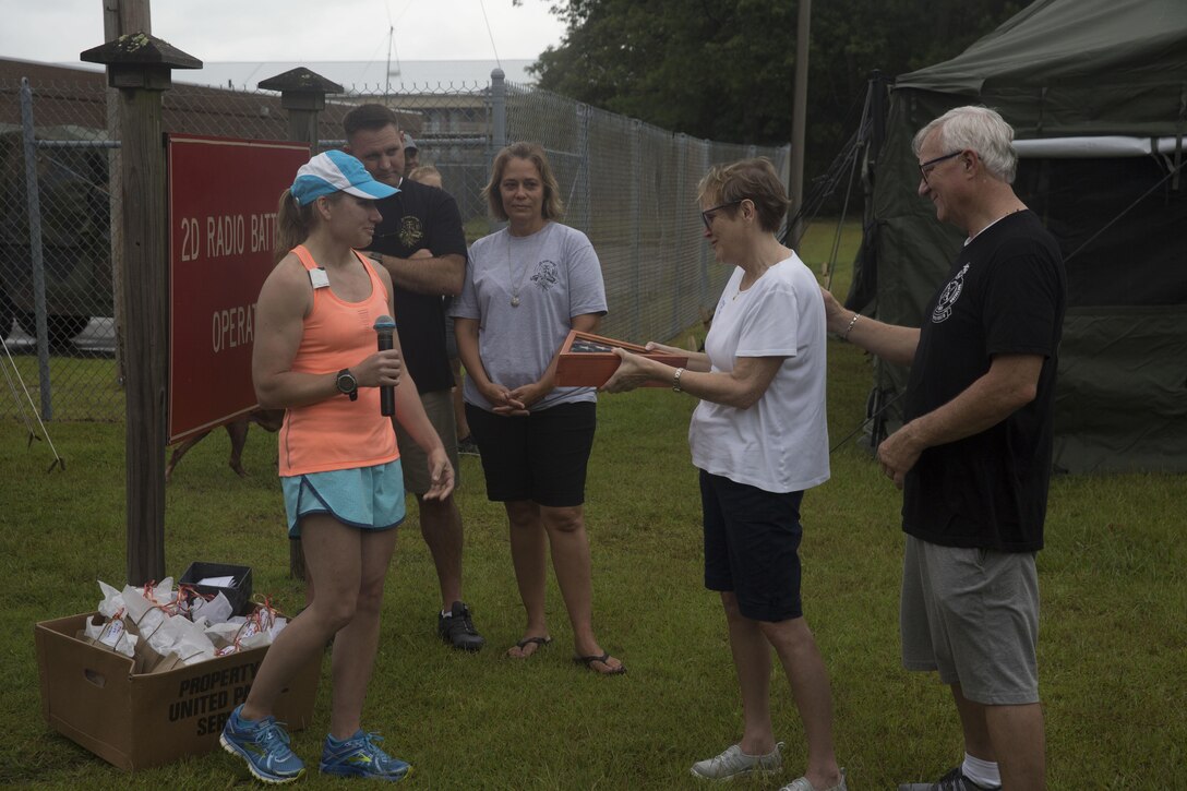 Maj. Sasha Kuhlow presents the Pyeatt family an American flag. The flag was flown at Sgt. Pyeatt’s camp during the time of his death. Sgt. Pyeatt was killed in action Afghanistan, February 2011.