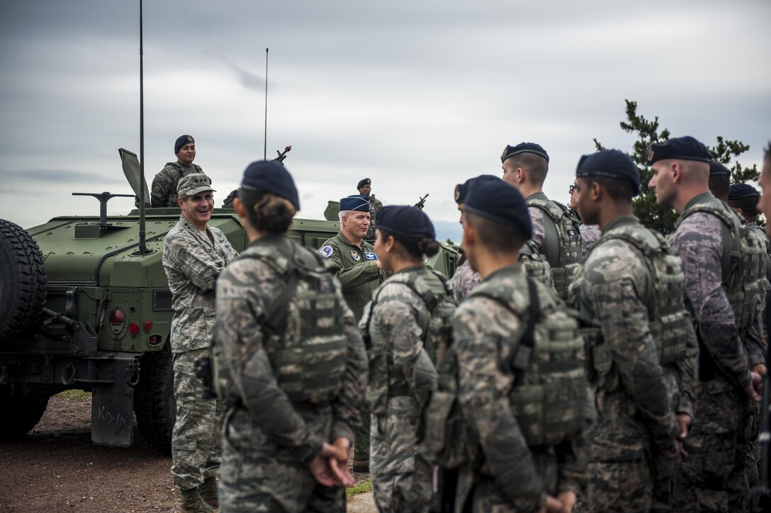 U.S. Air Force Lt. Gen. Jerry “JD” Harris, Chief of Staff for Strategic Plans and Requirements, Headquarters U.S. Air Force, Washington, D.C, and Lt. Gen. Brad Shwedo, Chief, Information Dominance and Chief Information Officer, Office of the Secretary of the Air Force, the Pentagon, Washington, D.C., speak with Airmen assigned to the 8th Security Forces Squadron at Kunsan Air Base, Republic of Korea, Aug. 14, 2017. The 8th SFS showcased their role in the first priority of the Wolf Pack’s mission, “Defend the Base.” The visit facilitated discussion between tactical-level Airmen and strategic-level planners to better enable advocacy for the Wolf Pack within Headquarters Air Forces at the Pentagon. (U.S. Air Force photo by Senior Airman Colville McFee)