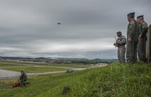 Lt. Gen. Jerry “JD” Harris, Chief of Staff for Strategic Plans and Requirements, Headquarters U.S. Air Force, Washington, D.C, and Lt. Gen. Brad Shwedo, Chief, Information Dominance and Chief Information Officer, Office of the Secretary of the Air Force, the Pentagon, Washington, D.C., look on as an 8th Security Forces Military Working Dog handler’s canine partner takes down a target at Kunsan Air Base, Republic of Korea, Aug. 14, 2017. The 8th SFS showcased their role in the first priority of the Wolf Pack’s mission, “Defend the Base.” The visit facilitated discussion between tactical-level Airmen and strategic-level planners to better enable advocacy for the Wolf Pack within Headquarters Air Forces at the Pentagon. (U.S. Air Force photo by Senior Airman Colville McFee)