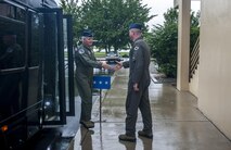 Lt. Gen. Jerry “JD” Harris, Chief of Staff for Strategic Plans and Requirements, Headquarters U.S. Air Force, Washington, D.C, steps off the bus to shake hands with Col. David “Wolf” Shoemaker, 8th Fighter Wing commander, at Kunsan Air Base, Republic of Korea, Aug. 14, 2017. Gen. Harris, the 48th “Wolf” recounted his time as commander of the 8th FW during his visit and toured multiple squadrons around the installation. Visits of this type enable proactive advocacy at the Pentagon regarding issues and best practices specific to the unique mission on the Korean Peninsula and the Wolf Pack’s capabilities which support the overall U.S. Forces Korea mission here. (U.S. Air Force photo by Senior Airman Colville McFee)