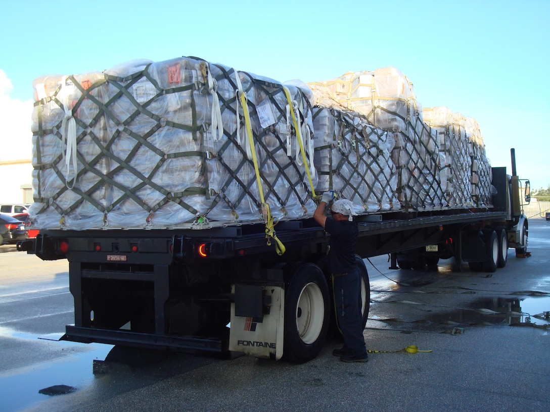 DLA Distribution Guam personnel secure five 463L Air Force pallets of Talisman Saber ‘17 cargo for transport to the Cargo Deployment Function staging site at Andersen Air Force Base for loading onto a Navy flight bound for Talisman Saber ‘17 participants in Australia.