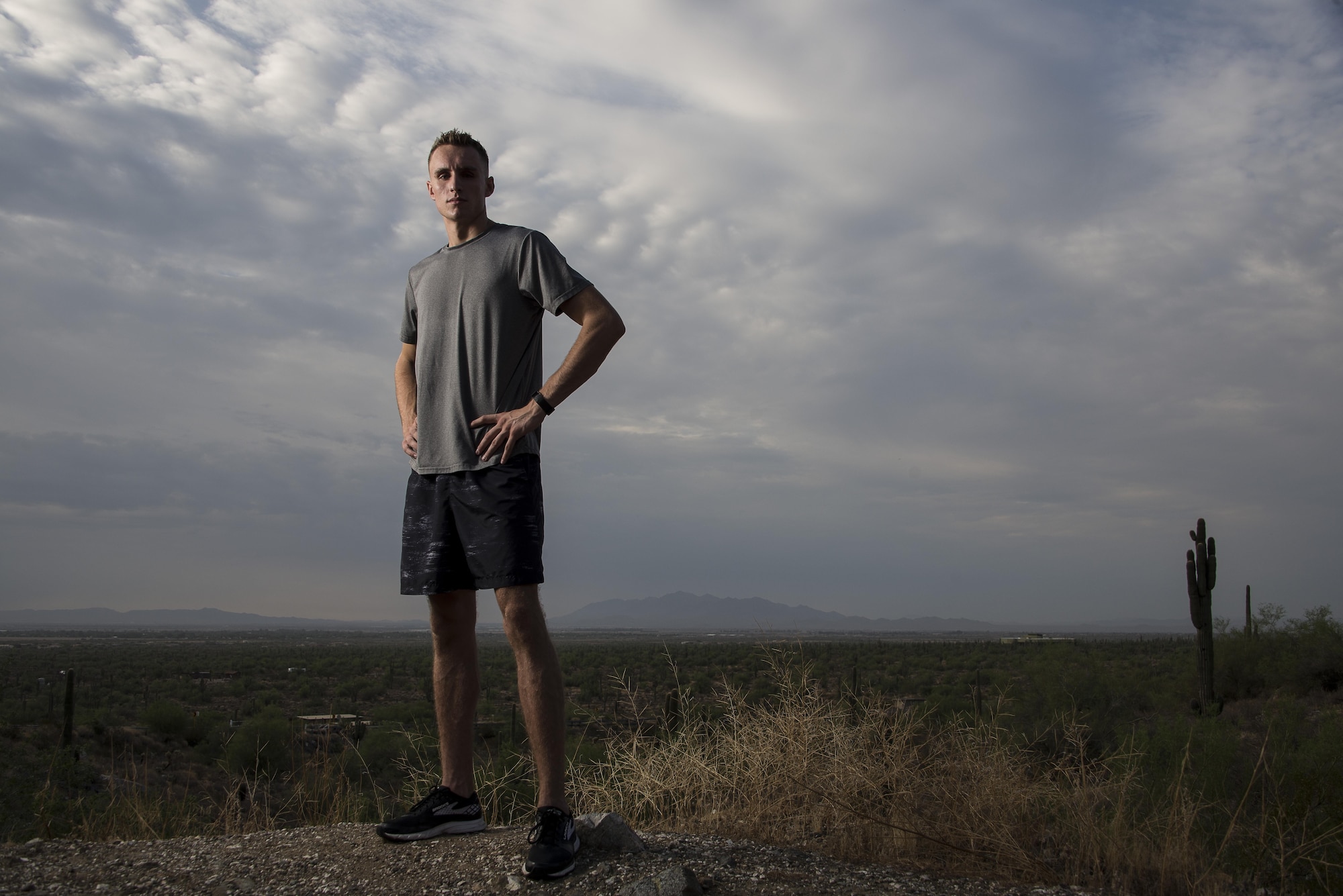 Airman 1st Class Wyatt Weaver, 56th Operations Support Squadron aircrew flight equipment journeyman, poses for a portrait at White Tank Mountain Regional Park in Buckeye, Ariz., July 28, 2017. Running approximately 35 miles a week, Weaver is currently training for the 21st Air Force Marathon held Sept. 16, 2017, at Wright Patterson Air Force Base. (U.S. Air Force Photo/Airman 1st Class Alexander Cook)