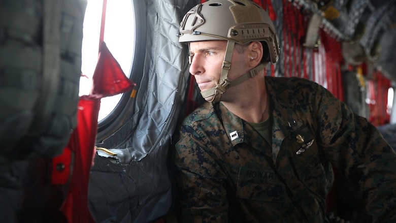 Capt. John Howarth the company operations liaison officer with Echo Company, 4th Reconnaissance Battalion, 4th Marine Division, Marine Forces Reserve, looks out the window of an U.S. Army Boeing CH-47 Chinook during a high altitude, high opening (HAHO) jump at Camp Grayling Joint Maneuver Training Center, Michigan, during exercise Northern Strike 17, Aug. 2, 2017.