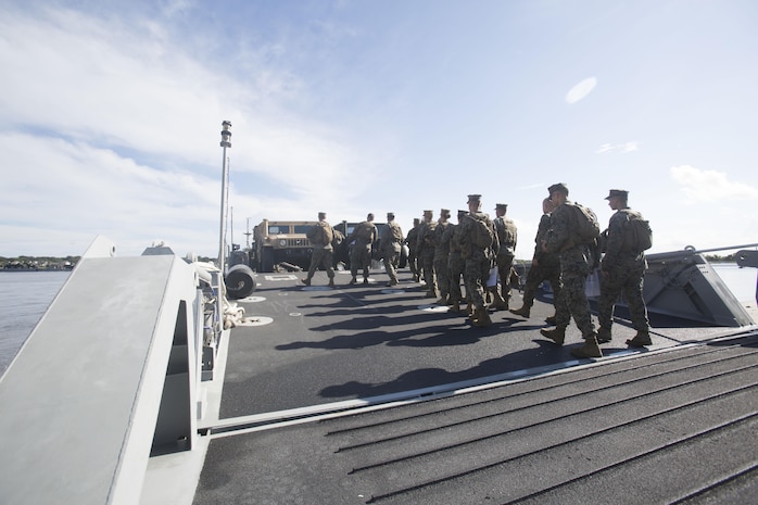 Marines drive a medium tactical vehicle replacement to a staging area during a maritime prepositioning force exercise at Blount Island, Fla., Aug. 10 - 11, 2017.