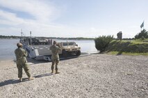 Marines drive a medium tactical vehicle replacement to a staging area during a maritime prepositioning force exercise at Blount Island, Fla., Aug. 10 - 11, 2017.