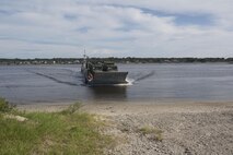 Marines drive a medium tactical vehicle replacement to a staging area during a maritime prepositioning force exercise at Blount Island, Fla., Aug. 10 - 11, 2017.