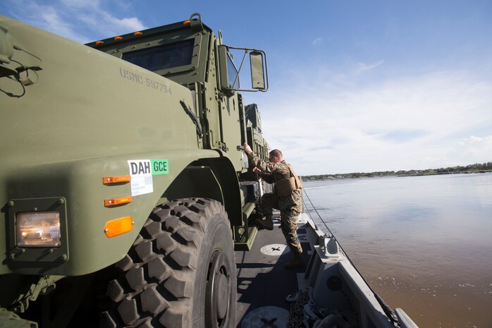 Marines drive a medium tactical vehicle replacement to a staging area during a maritime prepositioning force exercise at Blount Island, Fla., Aug. 10 - 11, 2017.