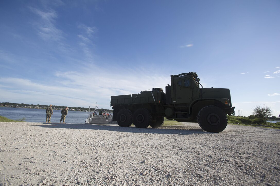 Marines drive a medium tactical vehicle replacement to a staging area during a maritime prepositioning force exercise at Blount Island, Fla., Aug. 10 - 11, 2017.