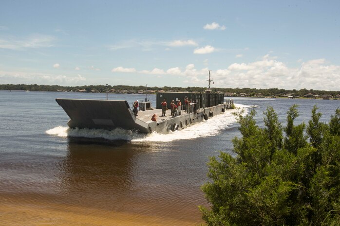 Sailors aboard a naval landing craft prepare to land and perform a lighterage during a marine prepositioning force exercise at Blount Island, Fla., Aug. 10 - 11, 2017.