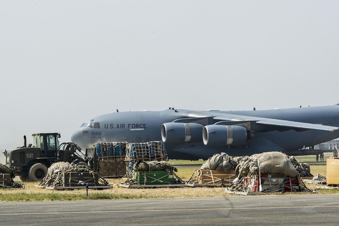 An Air Force C-17 Globemaster III is loaded with cargo