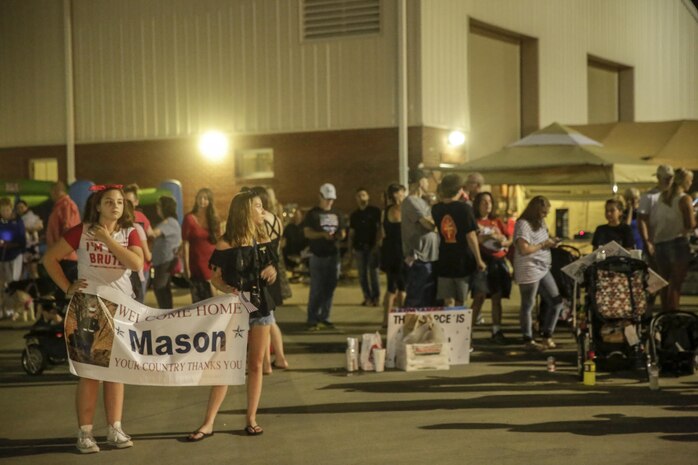 Families and friends wait for the Marines and Sailors of 3rd Battalion, 8th Marine Regiment to arrive at Camp Lejeune, N.C., August 12, 2017. Marines and Sailors returned from a 6-month Unit Deployment Program in Okinawa, Japan. V38 conducted exercises in Okinawa, Mainland Japan, South Korea, Thailand, the Philippines, Guam and other smaller islands. (U.S. Marine Corps photo by Lance Cpl. Leynard Kyle Plazo)