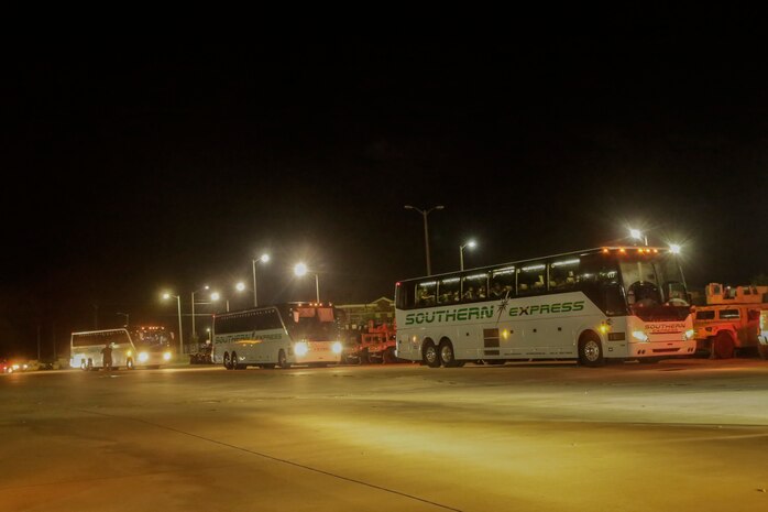 Buses carrying the Marines and Sailors of 3rd Battalion, 8th Marine Regiment arrive to where the families are waiting for them at Camp Lejeune, N.C., August 12, 2017. Marines and Sailors returned from a 6-month Unit Deployment Program in Okinawa, Japan. V38 conducted exercises in Okinawa, Mainland Japan, South Korea, Thailand, the Philippines, Guam and other smaller islands. (U.S. Marine Corps photo by Lance Cpl. Leynard Kyle Plazo)