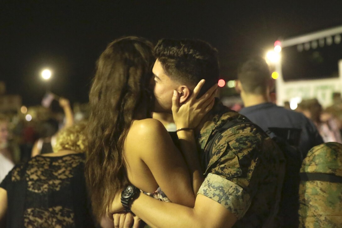 A Marine embraces his loved one after coming back from deployment, at Camp Lejeune, N.C., August 12, 2017. Marines and Sailors returned from a 6-month Unit Deployment Program in Okinawa, Japan. V38 conducted exercises in Okinawa, Mainland Japan, South Korea, Thailand, the Philippines, Guam and other smaller islands. (U.S. Marine Corps photo by Lance Cpl. Leynard Kyle Plazo)