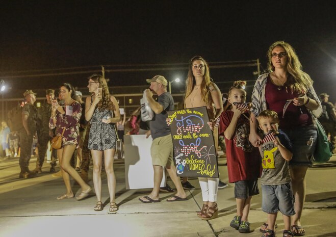 Friends and families look for their Marine as they arrive at camp Lejeune, N.C., August 12, 2017. Marines and Sailors returned from a 6-month Unit Deployment Program in Okinawa, Japan. V38 conducted exercises in Okinawa, Mainland Japan, South Korea, Thailand, the Philippines, Guam and other smaller islands. (U.S. Marine Corps photo by Lance Cpl. Leynard Kyle Plazo)