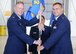 Col. James DeVere, 302nd Airlift Wing commander, left, passes the 302nd Aircraft Maintenance Squadron guidon to Maj. John Fite, the new 302nd AMXS, commander, during the squadron’s assumption of command ceremony at Peterson Air Force Base, Colo., Aug. 6, 2017. The passing of an Air Force squadron's guidon signifies the change of command for a military unit, as the squadron's colors are handed to the incoming commander. Fite highlighted his priority for the squadron during his command was to ensure its readiness for supporting C-130 Hercules aircraft operations at any time. Fite takes charge of the squadron after the departure of Lt. Col. John Drain, who now commands the 15th Maintenance Squadron at Joint Base Pearl Harbor Hickam, HI. (U.S. Air Force photo/1st Lt. Stephen J. Collier)