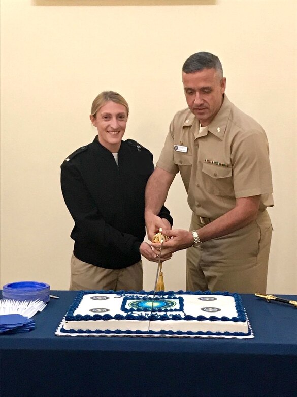 Naval Health Clinic Charleston Commanding Officer Capt. Dale Barrette, right, and Lt. j.g. Haley Bouchard, physician assistant, cut the cake during NHCC's celebration of the 70th birthday of the Medical Service Corps Aug. 4 at NHCC. After the outbreak of World War II, on Aug. 4, 1947, President Harry Truman signed the Army-Navy Medical Service Corps Act, establishing a permanent officer category to complement the existing medical department officer corps.