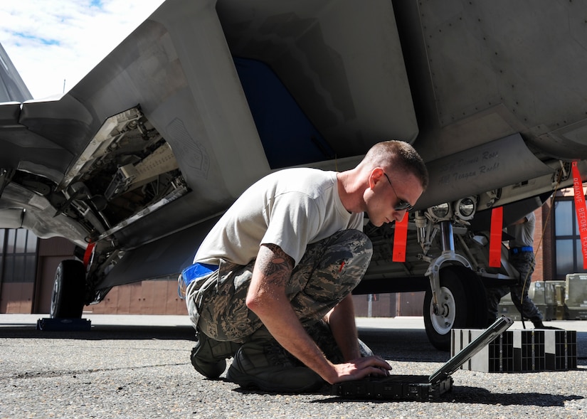 U.S. Air Force Staff Sgt. Justin Smith, 94th Aircraft Maintenance Unit load crew chief, fills out a loading checklist during the 1st Maintenance Squadron Weapons Load Crew of the Quarter competition at Joint Base Langley-Eustis, Va., Aug. 4, 2017.