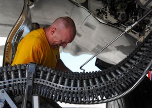 U.S. Air Force Staff Sgt. Brian Smith, 27th Aircraft Maintenance Unit load crew chief, loads munitions onto an F-22 Raptor during the 1st Maintenance Squadron Weapons Load Crew of the Quarter competition at Joint Base Langley-Eustis, Va., Aug. 4, 2017.