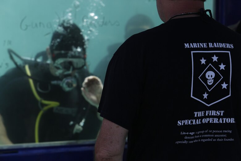 Bruce Burlingham, U.S. Marine Raider Association, observes a diving demonstration at the annual Gold Star Families and Raider Reunion at the 1st Marine Raider Battalion Headquarters on August 11, 2017. The reunion is held annually to honor the families of the fallen and to maintain ties to the original Marine Raiders. (U.S. Marine Corps photo by Lance Cpl. Lukas Kalinauskas)