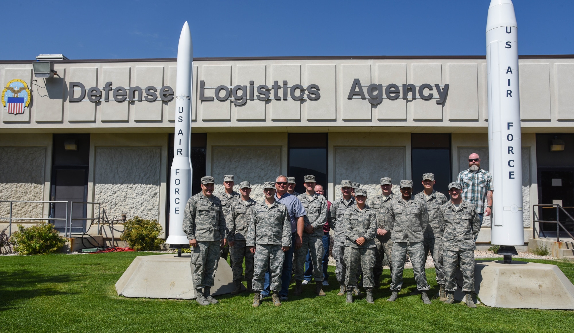 F.E. Warren and Hill Air Force Base’s Logistics Officer Association members pose for a photo in front of the Defense Logistics Agency at Hill Air Force Base, Utah, Aug. 10, 2017.