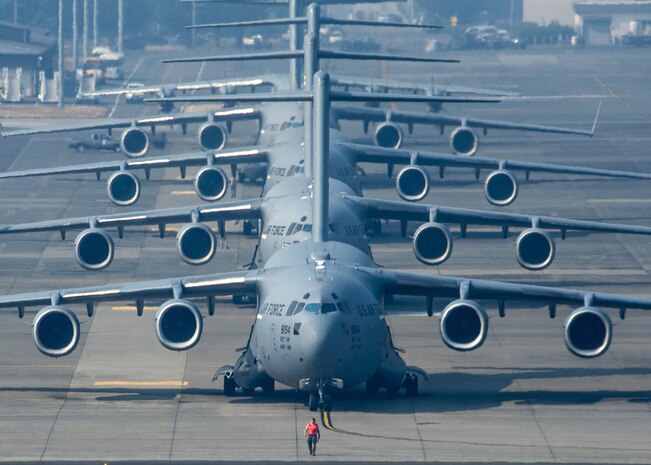 Four C-17 Globemaster III's and a Airbus A400M Atlas line up in preparation for Mobility Guardian's elephant walk, Joint Base Lewis-McChord, Wash., Aug. 2, 2017. More than 3,000 Airmen, Soldiers, Sailors, Marines and international partners converged on the state of Washington in support of Mobility Guardian. The exercise is intended to test the abilities of the Mobility Air Forces to execute rapid global mobility missions in dynamic, contested environments. Mobility Guardian is Air Mobility Command's premier exercise, providing an opportunity for the Mobility Air Forces to train with joint and international partners in airlift, air refueling, aeromedical evacuation and mobility support. The exercise is designed to sharpen Airmen’s skills in support of combatant commander requirements. (U.S. Air Force photo by Tech. Sgt. Jodi Martinez)