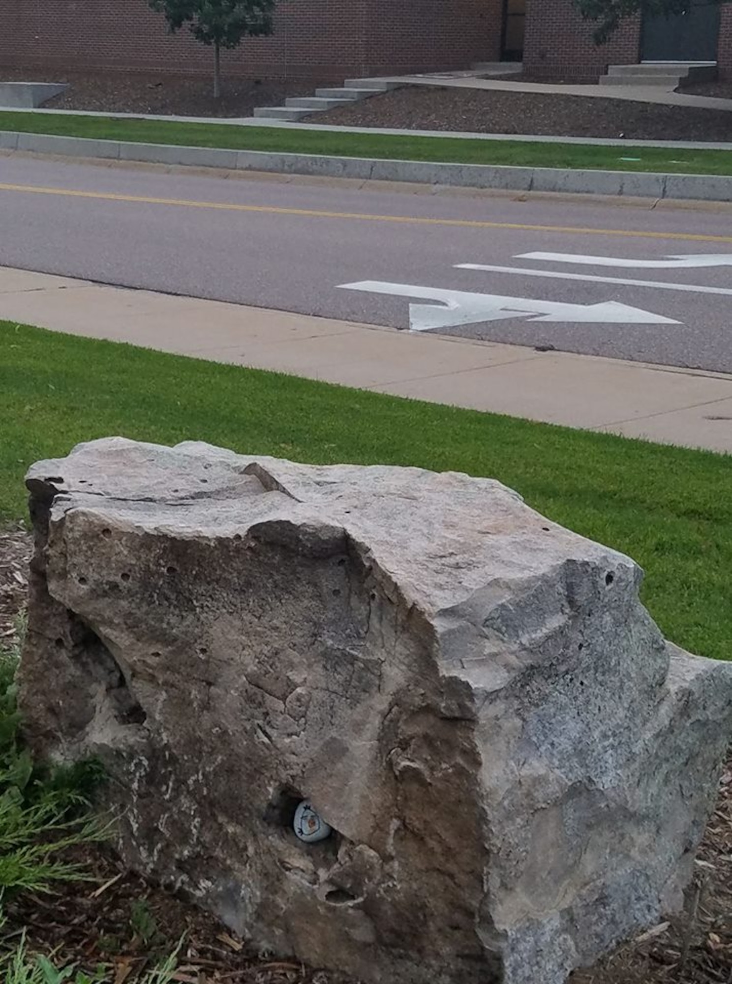 Sgt. Irvin Brubacher, F Forward Support Company, 2-12 Field Artillery, radar repairer, painted and hid the small rock in the larger rock on Peterson Air Force Base, Colo., Aug. 4, 2017. PAFB rocks! is a Facebook group of Peterson AFB members and families that paint and hid rocks all over base for others to find. (courtesy photo by Sgt. Irvin Brubacher)