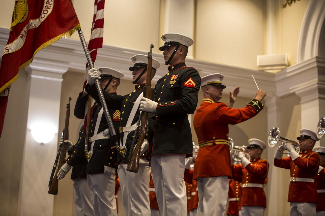 The U.S. Marine Corps Color Guard presents the National Ensign and the U.S. Marine Corps Colors during an indoor ceremony at Marine Barracks Washington D.C., Aug. 11, 2017. The guest of honor for the parade was Secretary of Agriculture, the Honorable Sonny Perdue, and the hosting official was the Assistant Commandant of the United States Marine Corps, Gen. Glenn M. Walters. (Official Marine Corps photo by Lance Cpl. Damon Mclean/Released)