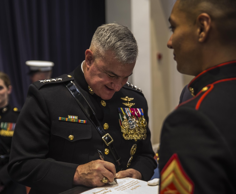 Assistant Commandant of the Marine Corps, Gen. Glenn M. Walters, signs the official guestbook after an indoor ceremony at Marine Barracks Washington D.C., Aug. 11, 2017. The guest of honor for the parade was Secretary of Agriculture, the Honorable Sonny Perdue, and the hosting official was the Assistant Commandant of the United States Marine Corps, Gen. Glenn M. Walters. (Official Marine Corps photo by Lance Cpl. Damon Mclean/Released)