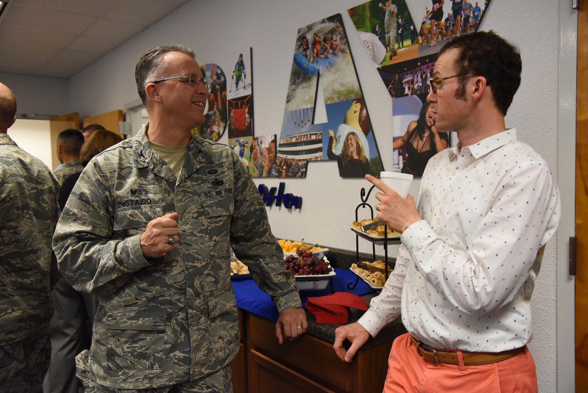 Col. John DeStazio, 2nd Air Force Technical Training Operations Center commander, and Ryan Goldin, Florence Gardens-Community Development vice president, engage in conversation during an honorary commanders 81st Mission Support Group orientation tour in the Sablich Center Aug. 10, 2017, on Keesler Air Force Base, Miss. The honorary commander program is a partnership between base leadership and local civic leaders to promote strong ties between military and civilian leaders. (U.S. Air Force photo by Kemberly Groue)