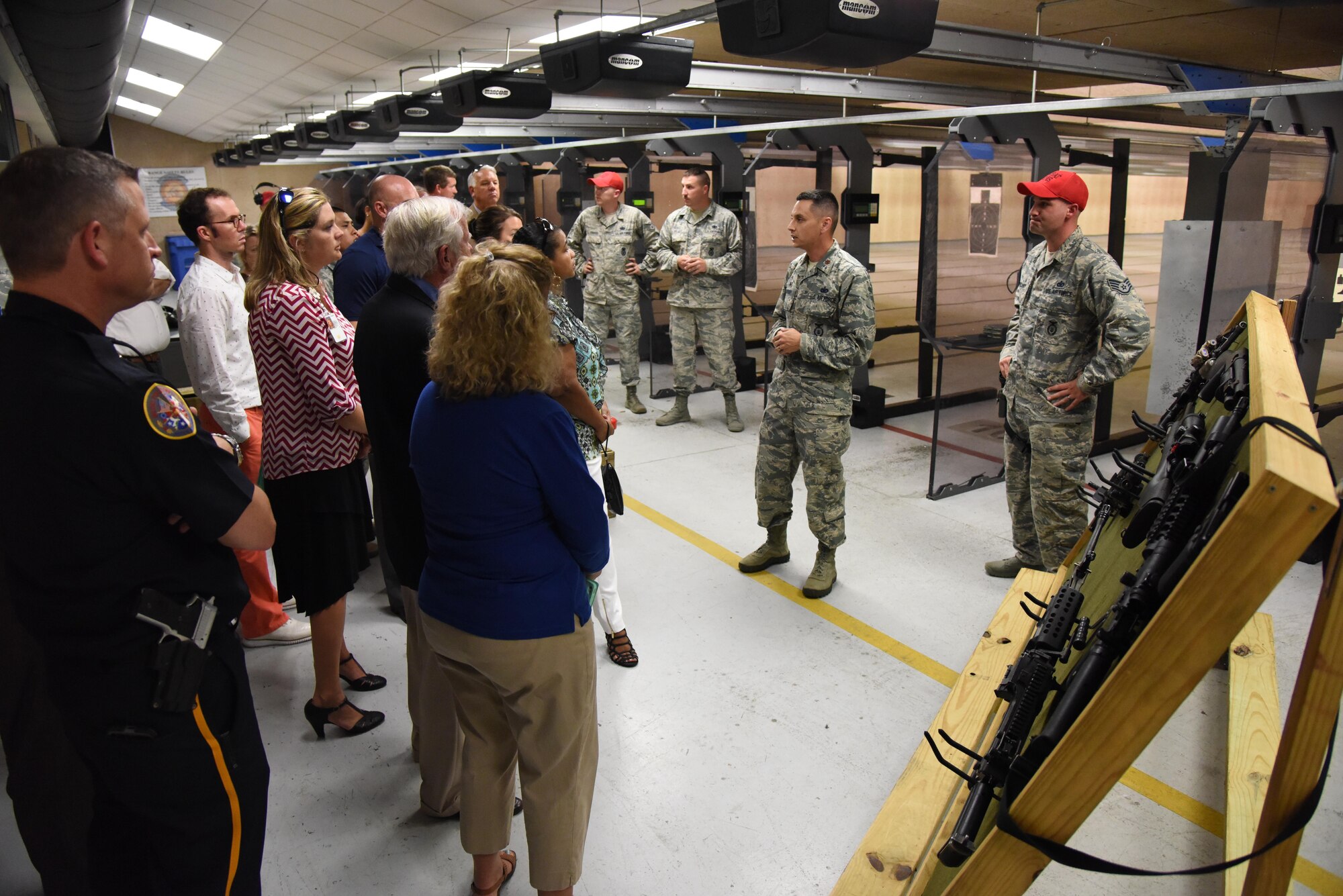Maj. Jonathon Murray, 81st Security Forces Squadron commander, gives a briefing on the 81st SFS indoor firing range capabilities during an honorary commanders 81st Mission Support Group orientation tour Aug. 10, 2017, on Keesler Air Force Base, Miss. The honorary commander program is a partnership between base leadership and local civic leaders to promote strong ties between military and civilian leaders. (U.S. Air Force photo by Kemberly Groue)