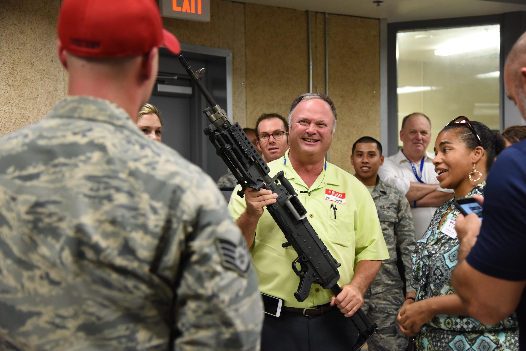 Terry Powell, Edgewater Mall manager, holds a weapon while touring the 81st Security Forces Squadron indoor firing range during an honorary commanders 81st Mission Support Group orientation tour Aug. 10, 2017, on Keesler Air Force Base, Miss. The honorary commander program is a partnership between base leadership and local civic leaders to promote strong ties between military and civilian leaders. (U.S. Air Force photo by Kemberly Groue)