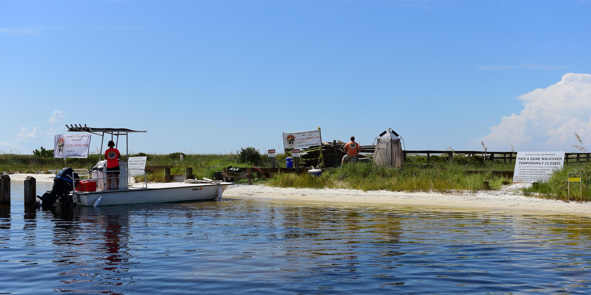Contractors from Commercial Diving International Services work on the Tyndall pier and boardwalk at Shell Island, Fla., Aug. 10, 2017. The construction on the pier and boardwalk on the Tyndall side of Shell Island began July 31, 2017, and is scheduled to be completed before Labor Day 2017, but could be delayed if beachgoers continue to disturb the workers.