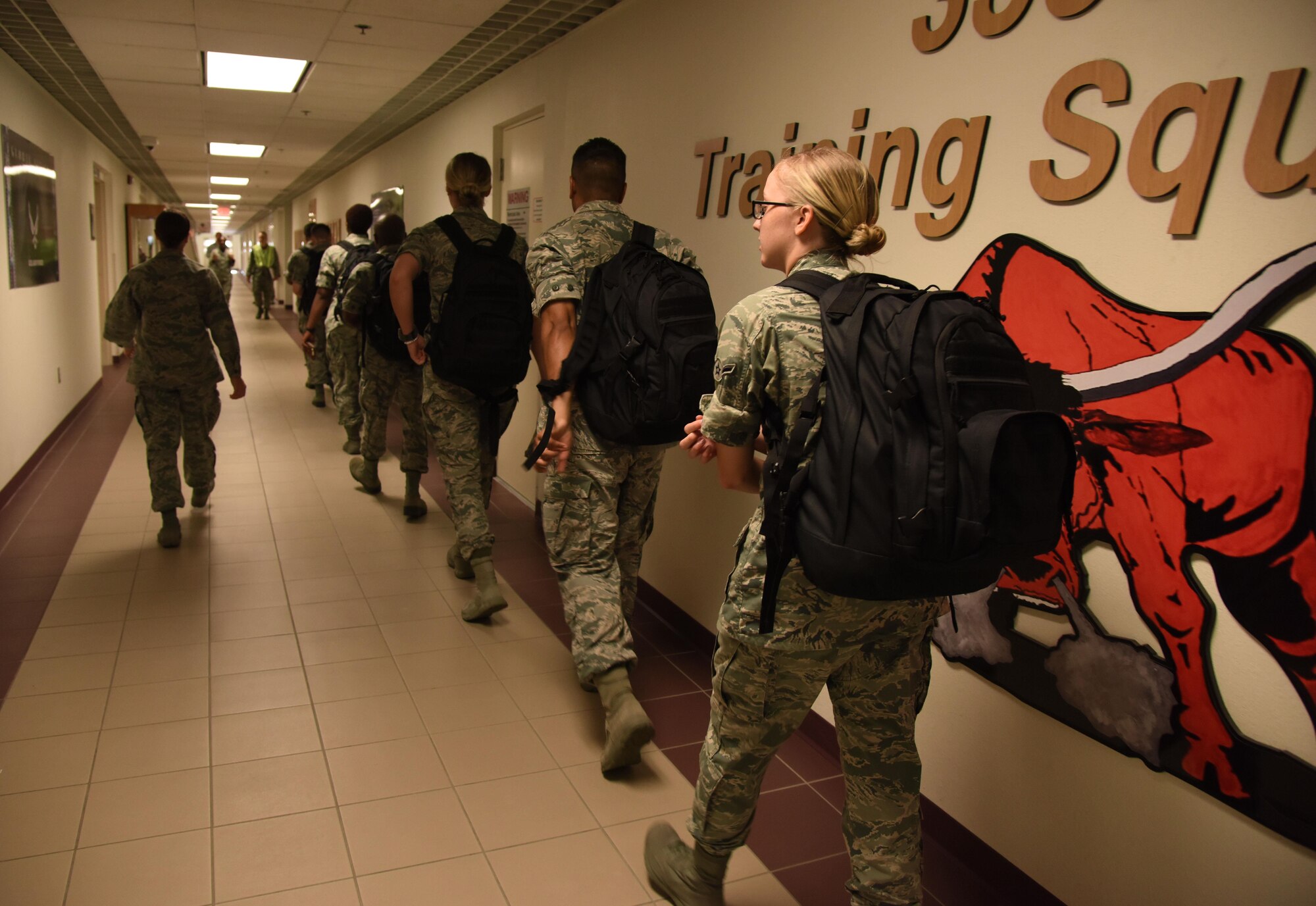 Airmen from the 335th Training Squadron in-process into Wolfe Hall for sheltering during a hurricane exercise Aug. 11, 2017, on Keesler Air Force Base, Miss. Each year Keesler personnel participate in exercise scenarios like this to ensure they can respond to hurricane threats. (U.S. Air Force photo by Kemberly Groue)