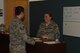 Staff Sgt. Megan Storms, 90th Force Support Squadron, reenlistments, extensions, enlisted promotions and retraining NCO in charge, assists a her customer at the Military Personnel Flight office at F.E. Warren Air Force Base, Wyo., August 9, 2017. The Military Personnel Flight is there to assists Airmen with any questions that arise. (U.S. Air Force photo by Terry Higgins)