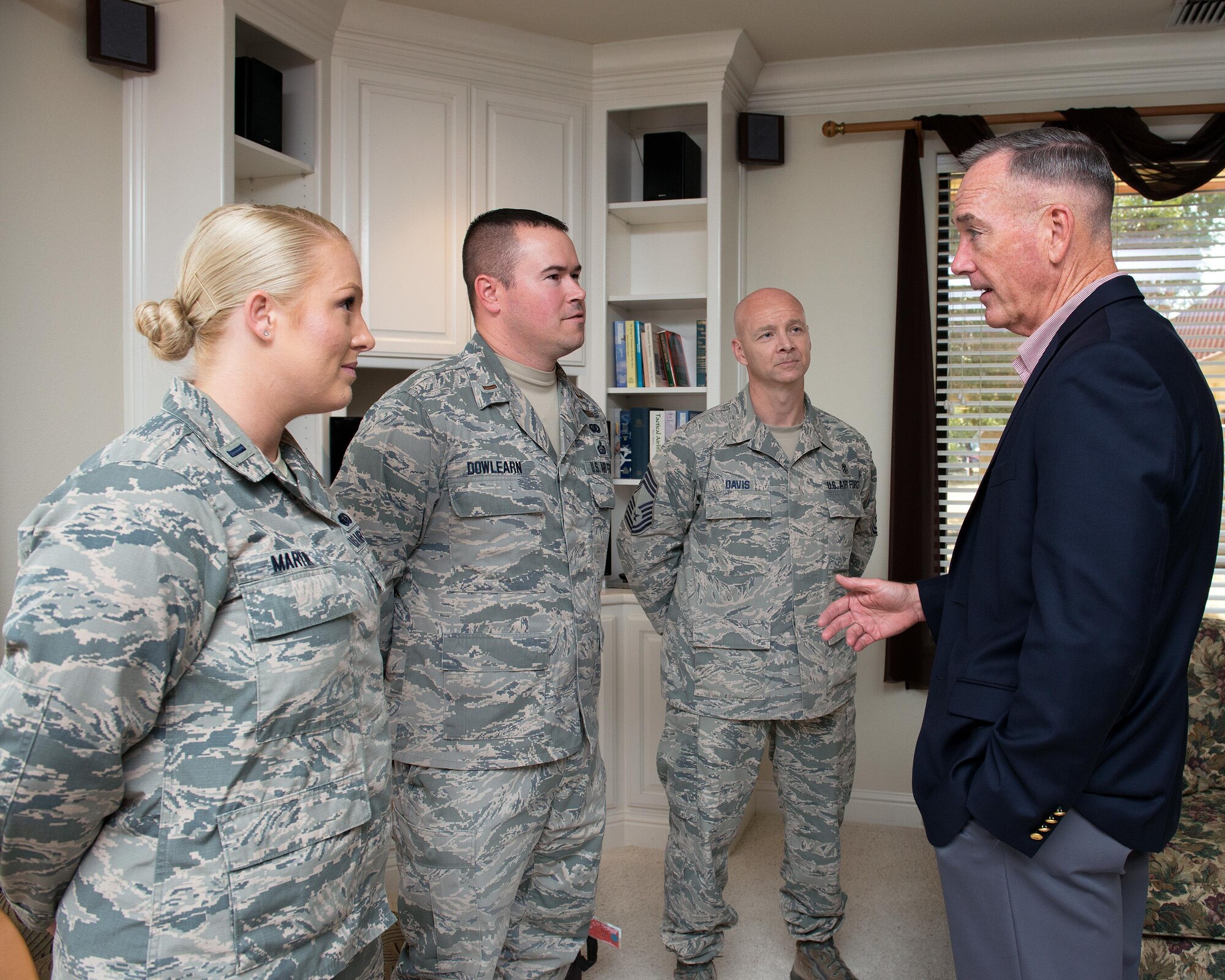 U.S. Air Force Col. John Klein, 60th Air Mobility Wing commander, talks with Marine Corps Gen. Joseph F. Dunford Jr., Chairman of the Joint Chiefs of Staff, during a gas and go at Travis Air Force Base, Calif., Aug, 10, 2017. (U.S. Air Force photo by Louis Briscese)
