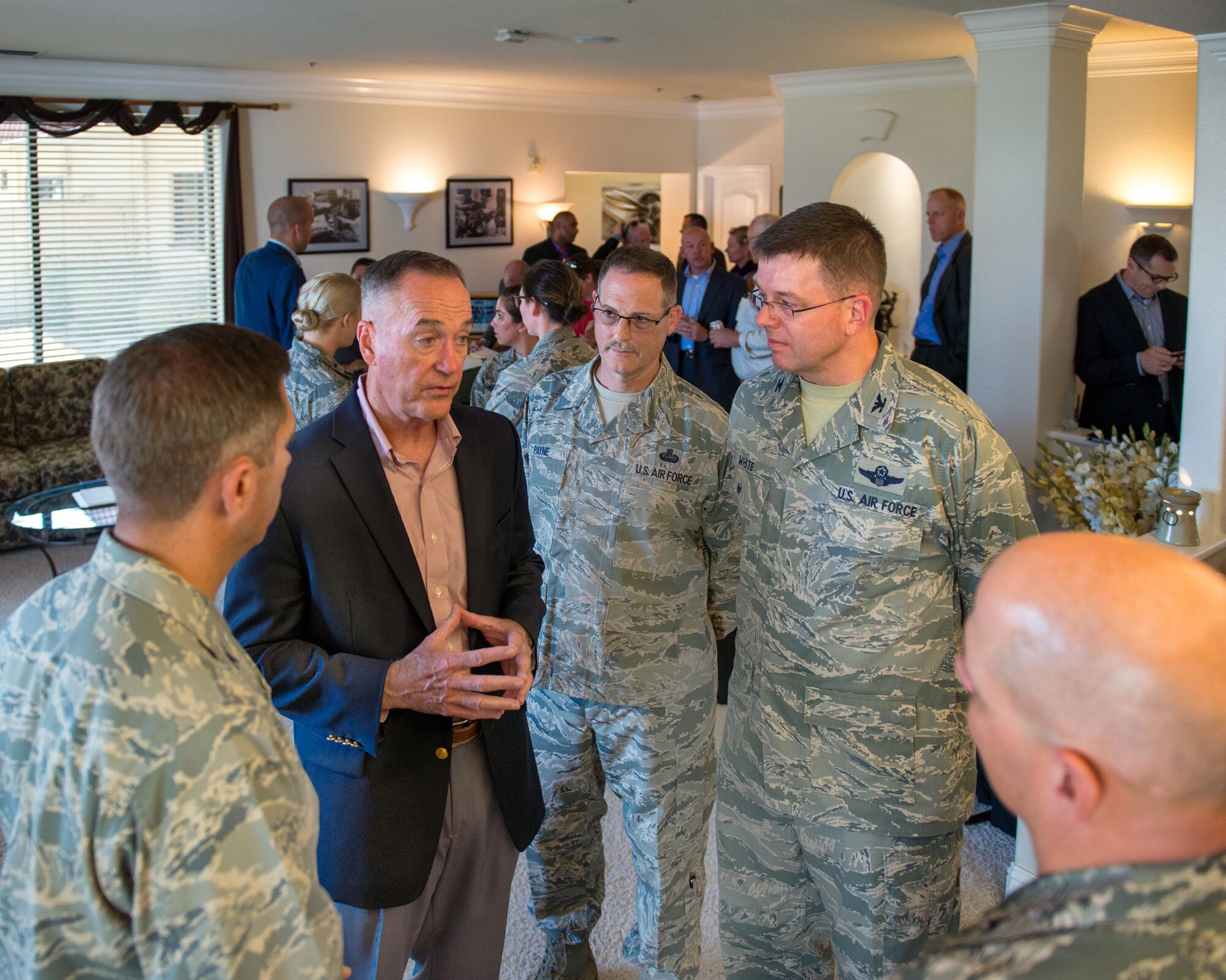 U.S. Air Force Col. John Klein, 60th Air Mobility Wing commander, talks with Marine Corps Gen. Joseph F. Dunford Jr., Chairman of the Joint Chiefs of Staff, during a gas and go at Travis Air Force Base, Calif., Aug, 10, 2017. (U.S. Air Force photo by Louis Briscese)