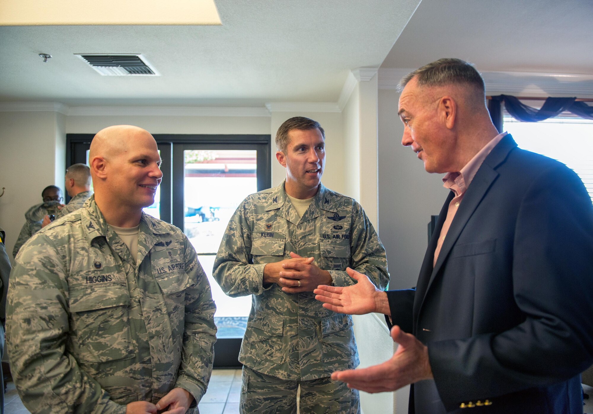 U.S. Air Force Col. John Klein, 60th Air Mobility Wing commander, talks with Marine Corps Gen. Joseph F. Dunford Jr., Chairman of the Joint Chiefs of Staff, during a gas and go at Travis Air Force Base, Calif., Aug, 10, 2017. (U.S. Air Force photo by Louis Briscese)