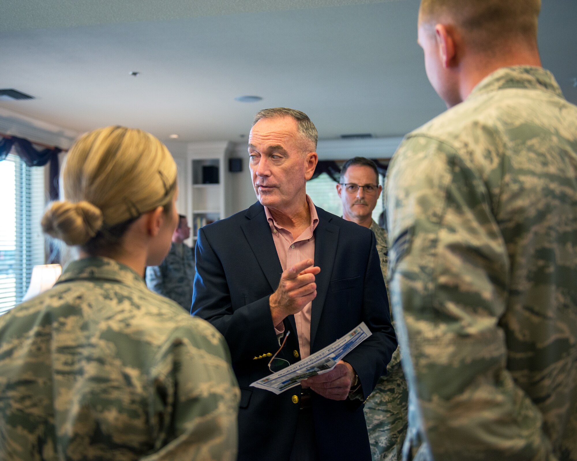 U.S. Air Force Col. John Klein, 60th Air Mobility Wing commander, talks with Marine Corps Gen. Joseph F. Dunford Jr., Chairman of the Joint Chiefs of Staff, during a gas and go at Travis Air Force Base, Calif., Aug, 10, 2017. (U.S. Air Force photo by Louis Briscese)