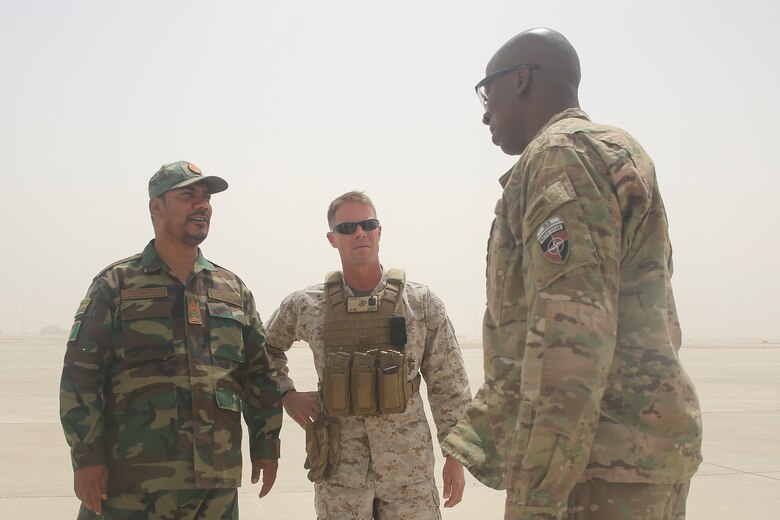 Afghan National Army Command Sgt. Maj. Alhaj Wafa, left, the Sergeant Major of 215th Corps, U.S. Marine Sgt. Maj. Darrell L. Carver, center, the Sergeant Major of Task Force Southwest, and U.S. Army Command Sgt. Maj. David M. Clark, right, the senior enlisted leader of U.S. Forces in Afghanistan, speak at Bastion Air Field, Afghanistan, Aug. 13, 2017. Senior enlisted leaders from 215th Corps conducted a noncommissioned officer seminar with more than 100 soldiers from the unit in order to enhance their leadership and build military-specific skills. (U.S. Marine Corps photo by Sgt. Lucas Hopkins)
