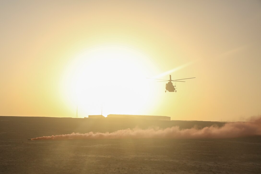 An Afghan Air Force Mi-17 Helicopter lands prior to extracting notionally-wounded Afghan National Army soldiers during casualty evacuation training at Camp Shorabak, Afghanistan, Aug. 14, 2017. Assisted by several U.S. advisors, more than 30 ANA soldiers rehearsed and refined their CASEVAC process, which will vastly increase the survivability and recovery rate of wounded personnel on the battlefield. (U.S. Marine Corps photo by Sgt. Lucas Hopkins)