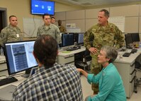 Secretary of the Air Force Heather Wilson and Air Force Chief of Staff Gen. David L. Goldfein learn about the Defense Innovation Unit Experimental program in the Combined Air Operations Center at Al Udeid Air Base, Qatar, Aug. 15, 2017. Wilson and Goldfein spoke with Airmen and industry professionals working on current projects to enhance CAOC capabilities. (U.S. Air Force photo by Staff Sgt. Desiree Economides)