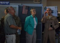 Lt. Col. Nicholas Russo, 609th Air Operations Center Combat Operations deputy director, explains current warfighting capabilities to Secretary of the Air Force Heather Wilson in the Combined Air Operations Center at Al Udeid Air Base, Qatar, Aug. 15, 2017. The CAOC is the command and control center for airpower throughout the U.S. Central Command area of responsibility. (U.S. Air Force photo by Staff Sgt. Desiree Economides)
