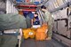 U.S. Navy Petty Officer 2nd Class Megan Schmidt, left, VRC-40 aircrew survival equipmentman, and Petty Officer 2nd Class Rhodessa Talagtag, VRC-40 aviation machinist mate, load mail onto a U.S. Navy C-2A Greyhound on RAF Mildenhall, England, ready to transport it to the USS George H.W. Bush aircraft carrier (CVN-77) Aug. 3, 2017. Members of the U.S. Navy from Norfolk, Va., were here as part of Exercise Saxon Warrior, a multinational joint maritime exercise involving 15 warships from five different nations, along with submarines, more than 100 aircraft and approximately 9,000 personnel. The C2-A transports people, equipment and mail out to the aircraft carrier as required. (U.S. Air Force photo by Karen Abeyasekere)