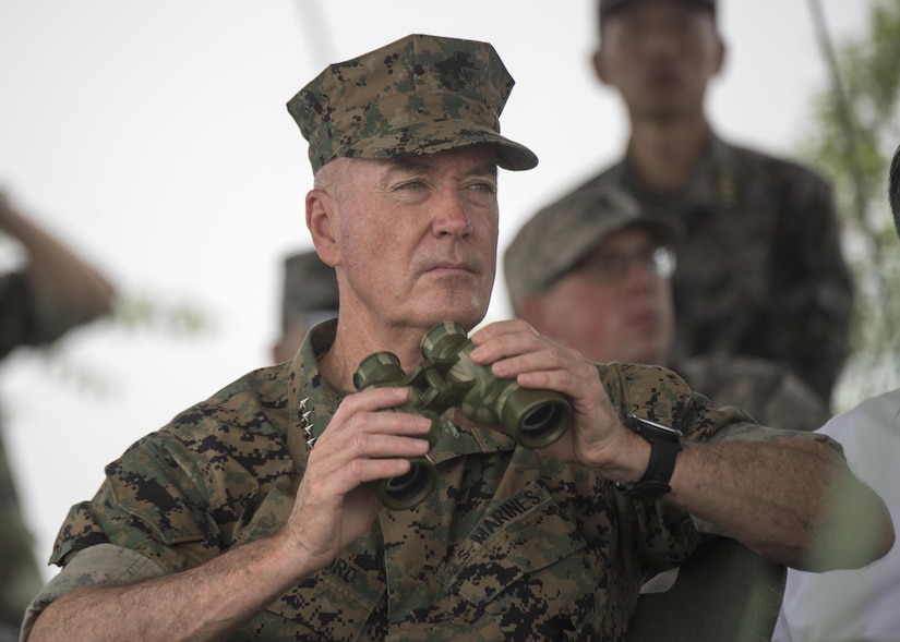 Marine Corps Gen. Joe Dunford, chairman of the Joint Chiefs of Staff, observes an attack exercise by Chinese troops