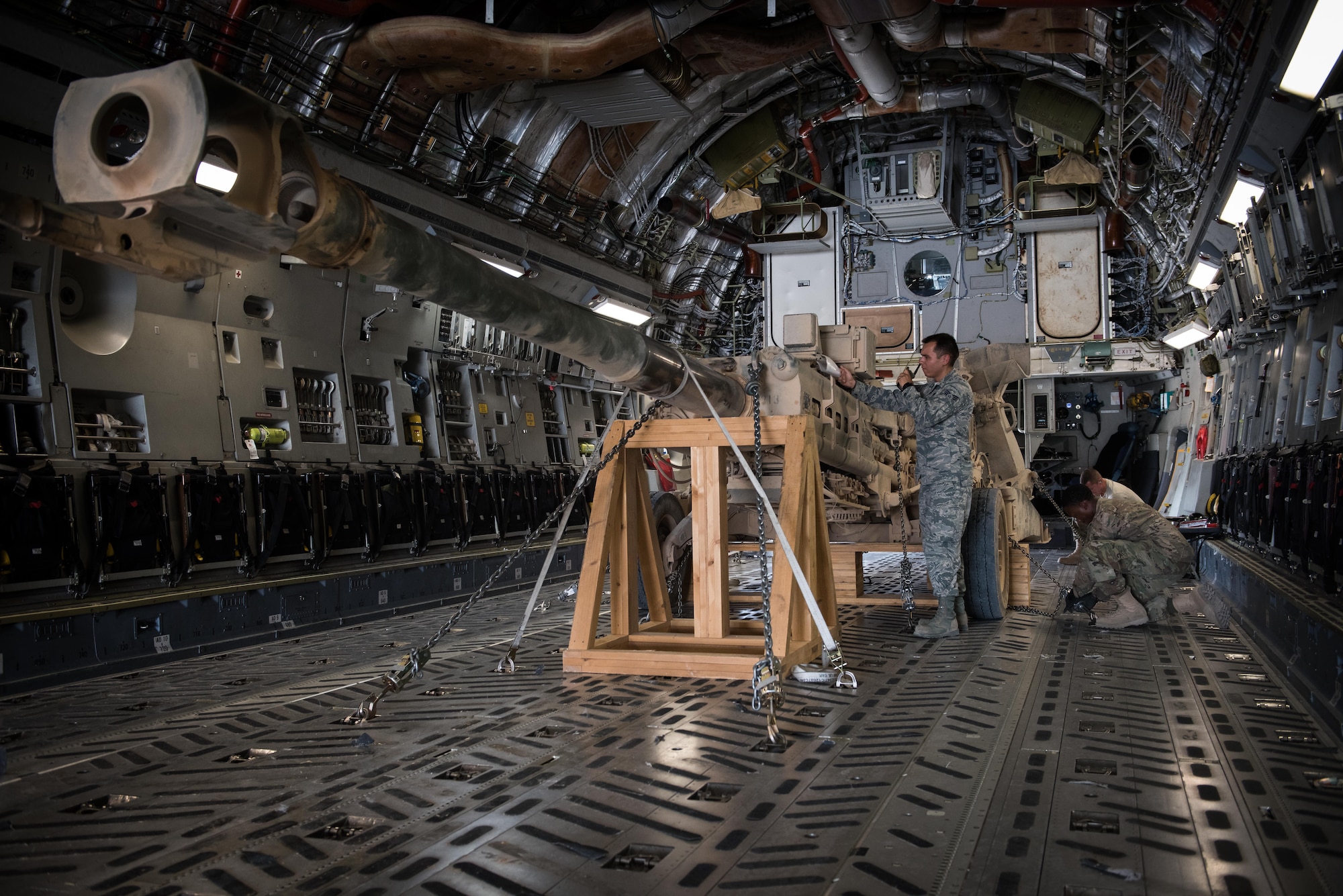 Senior Airman David Tiradeau, a ramp coordinator assigned to the 386th Expeditionary Logistics Readiness Squadron, relays information to the air terminal operations center, at an undisclosed location in Southwest Asia, August 15, 2017.